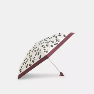 Paraguas Coach mini cherry print protección UV original Trendstore Chile compra segura Paraguas Coach compacto mujer estampado cerezas envío a todo Chile Detalle cherry print paraguas Coach diseño femenino original Chile Paraguas Coach con protección UV 99 mujer original Trendstore Chile Paraguas pequeño Coach portátil cartera mujer Chile Vista cerrada paraguas Coach mini con correa muñeca original Chile Accesorio lluvia sol Coach mujer original envío seguro Chile